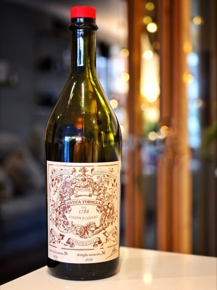 a bottle of vermouth shot in ambient light