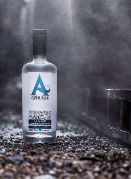 a bottle of haar vodka with mist and wheat