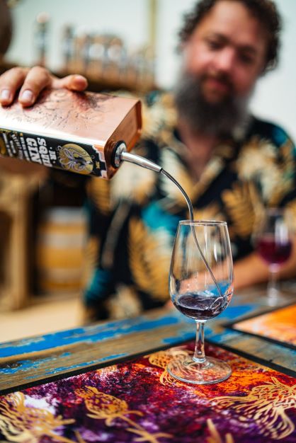 shaun pouring cocktails in the pocketful of stones distillery